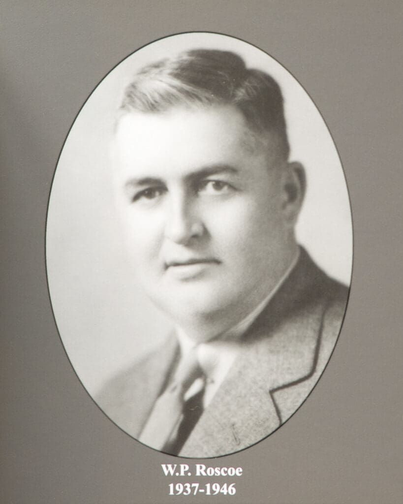 Oval black-and-white portrait of a man in a suit and tie, set in an oval frame with a caption reading'W.P. Roscoe 1937-1946'