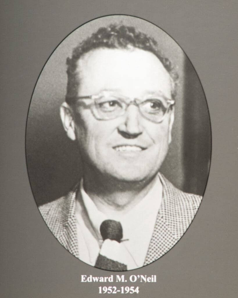 Oval black-and-white portrait of Edward M. O'Neil wearing glasses, suit, and tie, name and 1952-1954 beneath.