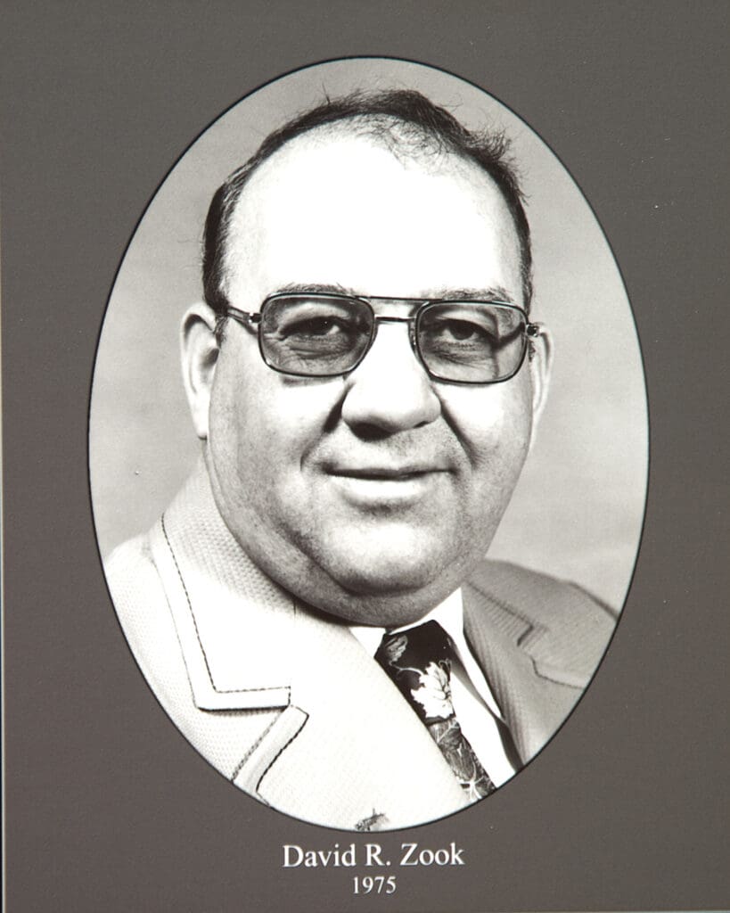 Black-and-white portrait of David R. Zook in a suit and tie, framed in an oval, with the name and year 1975 printed below.