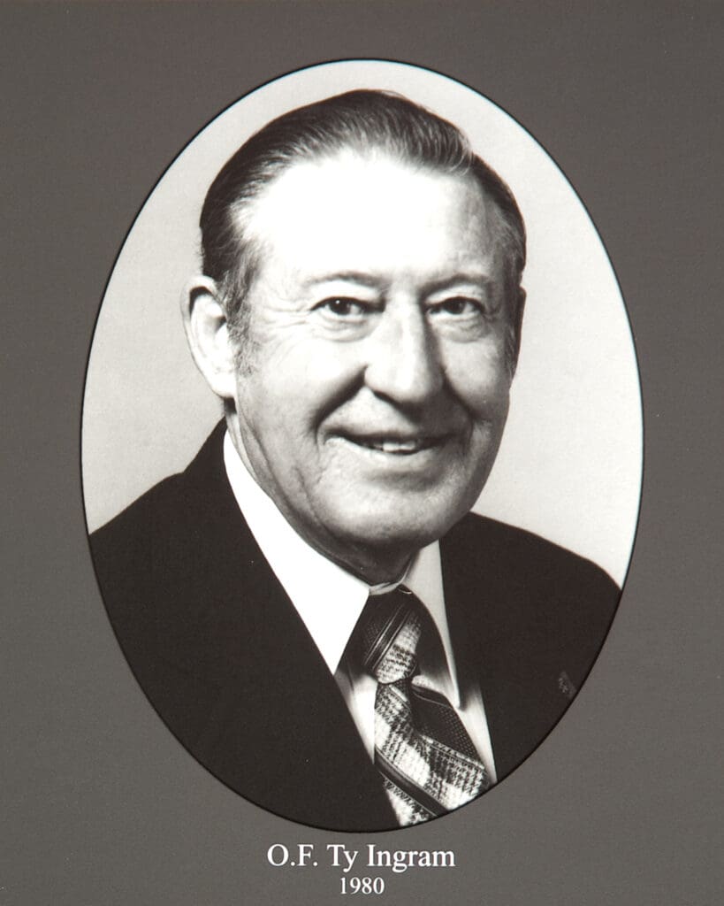 Black-and-white portrait of a smiling man in a suit inside an oval frame; caption reads 'O.F. Ty Ingram 1980'.